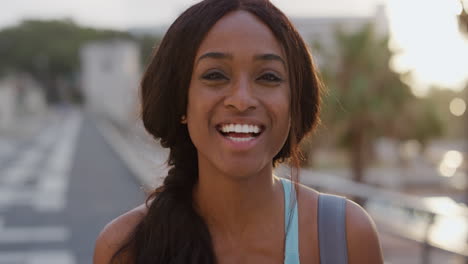 portrait happy african american woman laughing enjoying successful lifestyle excited black female beauty in urban city sunset