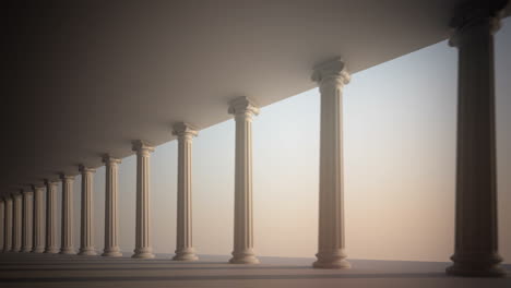 a row of white pillars in a hallway leading to an empty space