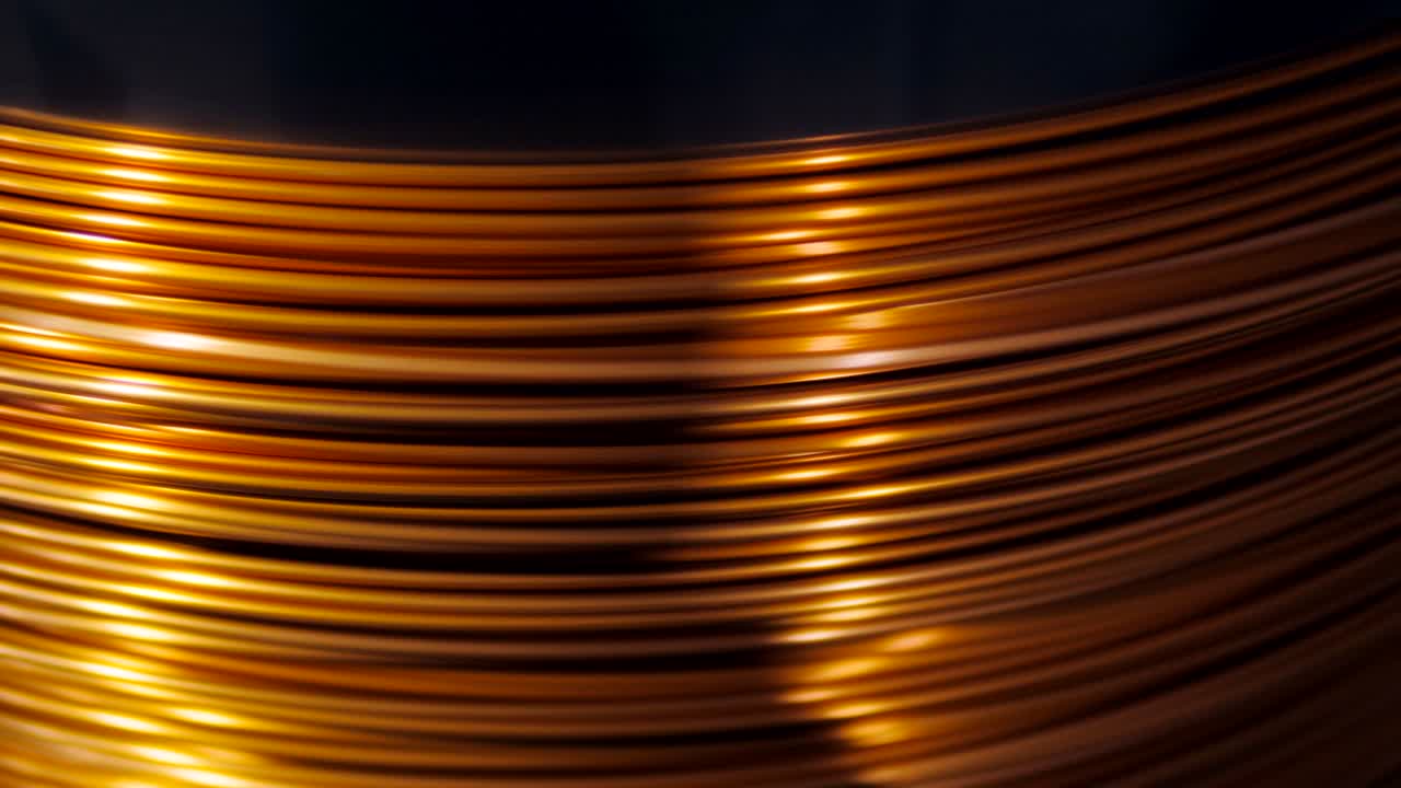 close-up of the rotation of the coil and wrap it copper wire. Manufacture of electric cable.