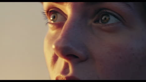 close-up of a woman's face at sunset