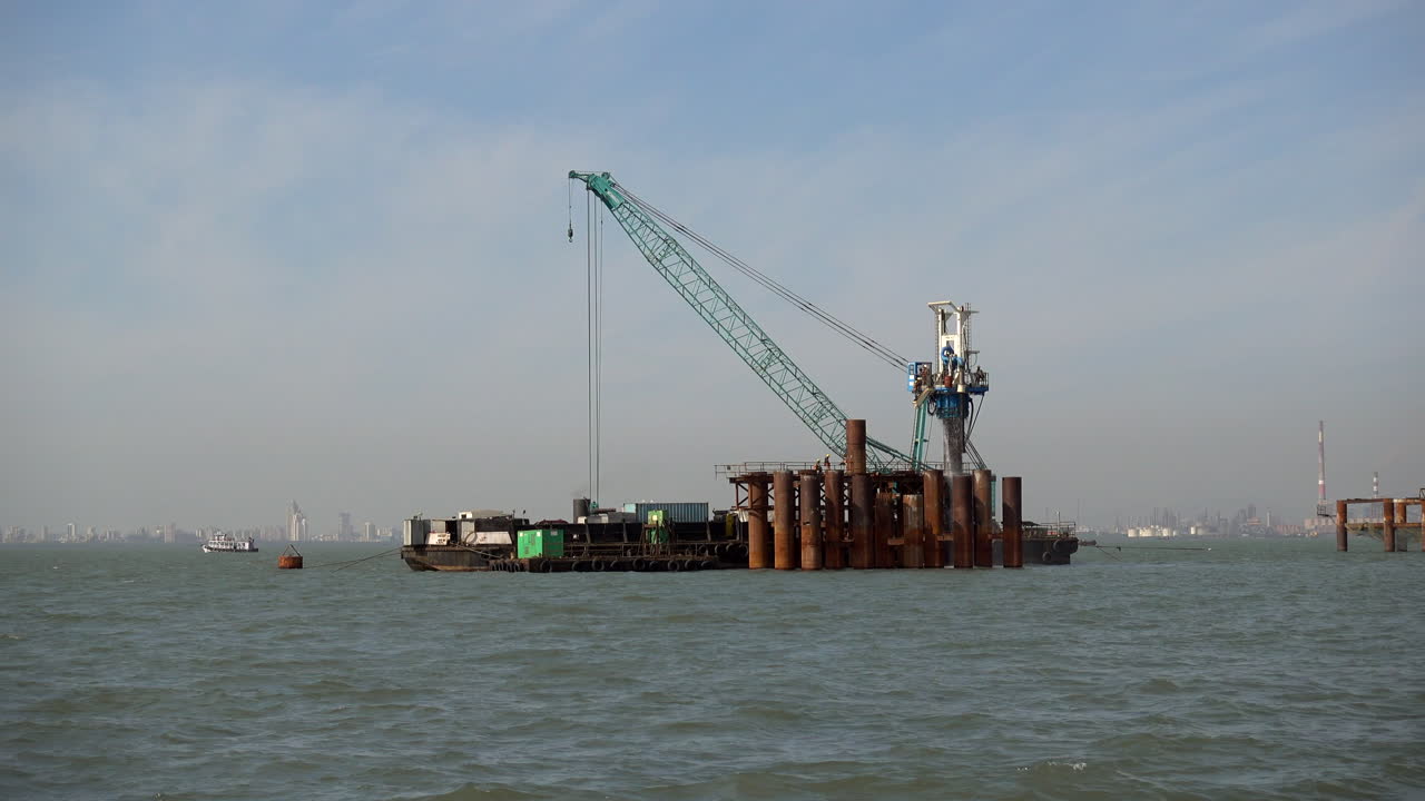 A pier building ship in the harbor of Mumbai, India.