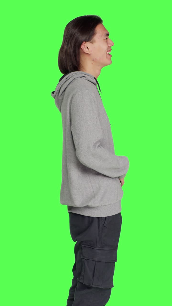 Profile of positive man laughing on camera