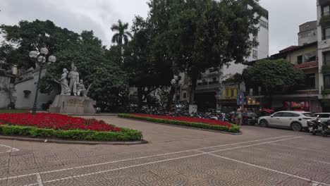 traffic and pedestrians crossing an urban intersection