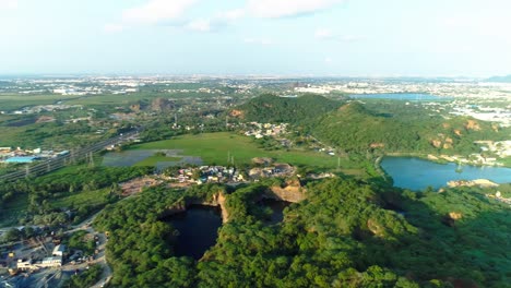 Drone-panning-shot-showing-city-and-its-surroundings