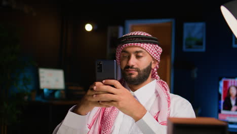 man texting his friends with cellphone