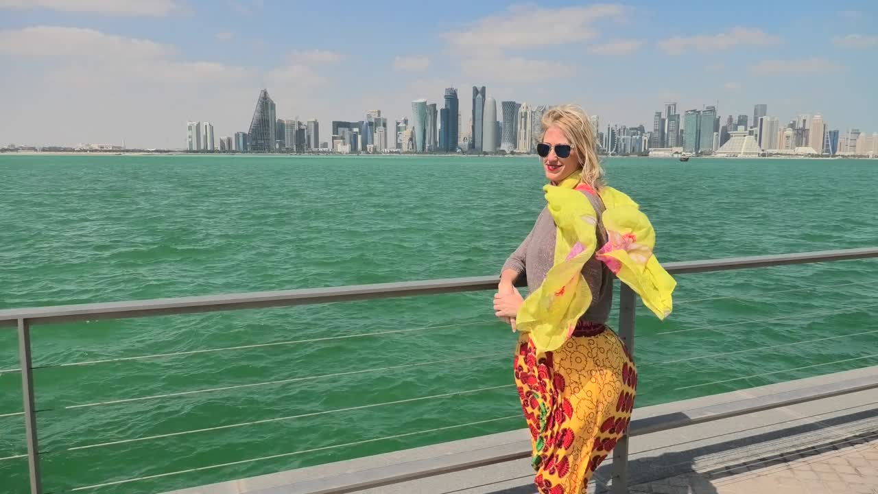 Woman by seascape of Doha