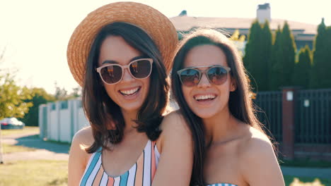 two happy women in swimsuits