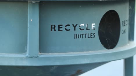 Recycle-Bottles-Sign-Imprinted-into-Trash-can-Tracking-Right-Close-Up