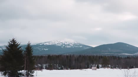 snowy mountains under a dramatic sky