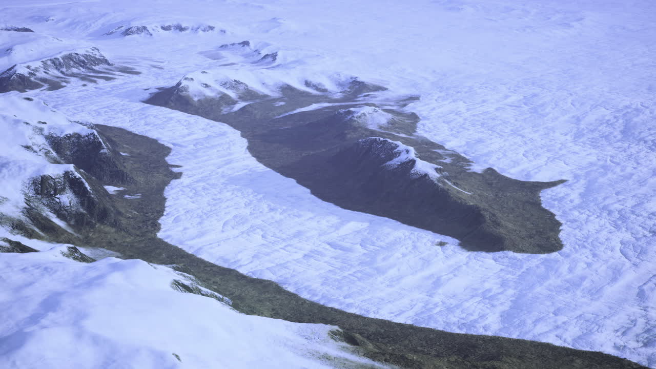 Majestic aerial view of snow covered mountains and glacial valley in winter