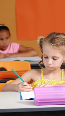 school kids studying in classroom