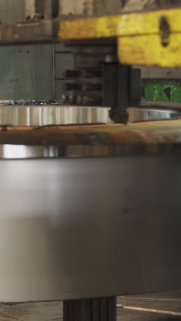 industrial machine processing a large metal component