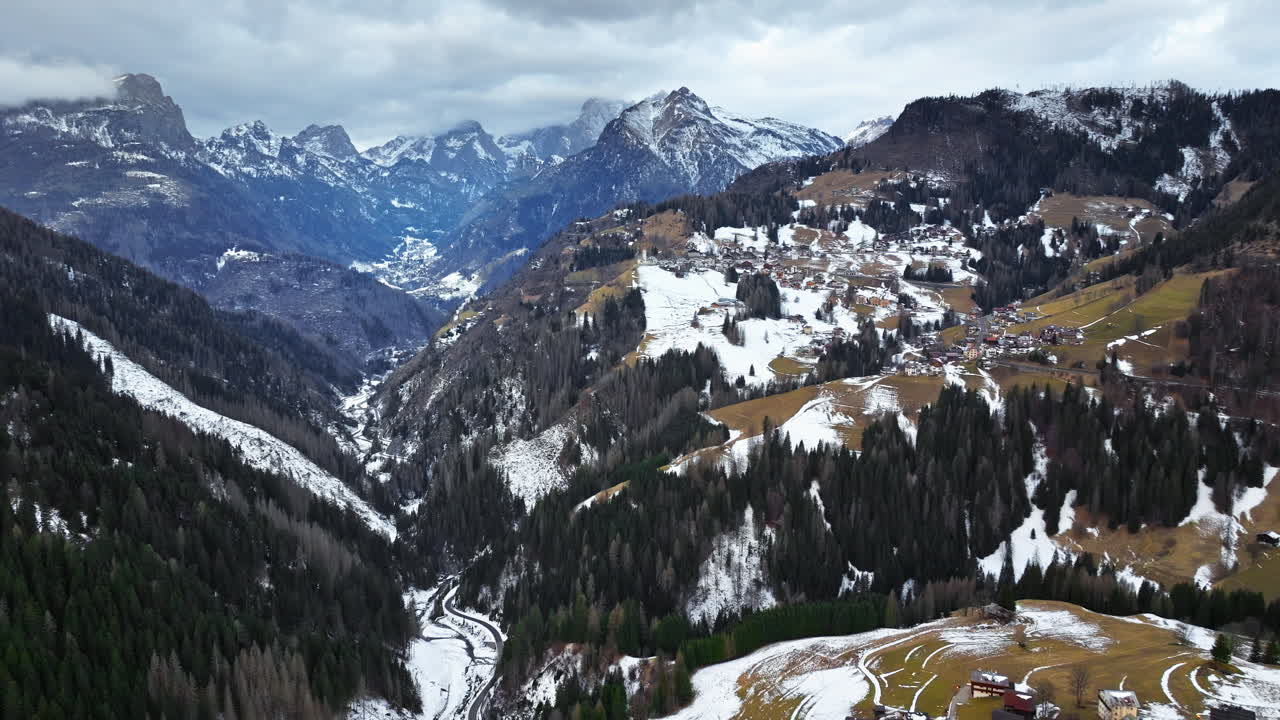 Aerial drone view of snow on the mountains in the Dolomites, Italy