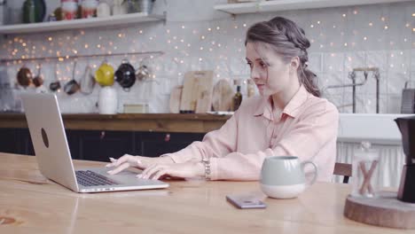 woman working from home in kitchen