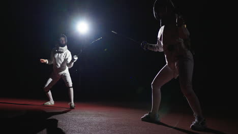 two fencers in a fencing match