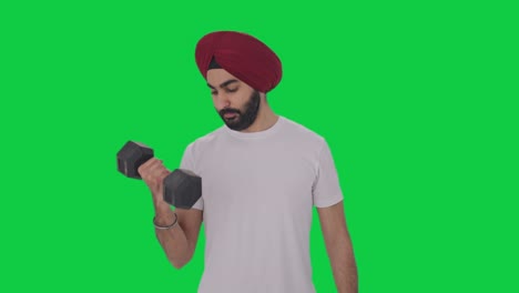 sikh indian man lifting heavy dumbbells green screen