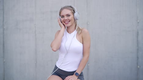 young woman listening to music outdoors