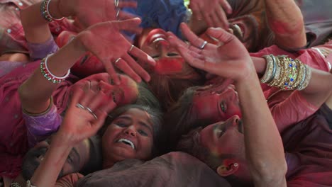 multi ethnic people celebrating the festival of colors holi in india