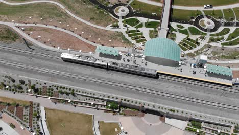 aerial shot of train leaving station