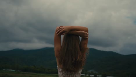 woman enjoying a scenic view in the mountains