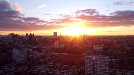 wide establishing drone shot hackney borough in london at sunset