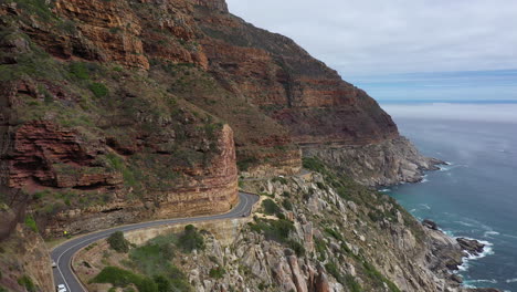 winning road along the ocean in south africa r44 aerial view