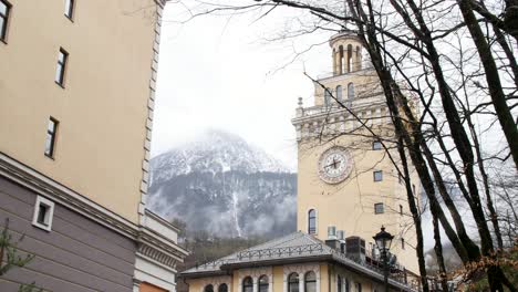 cityscape with clock tower and mountain view