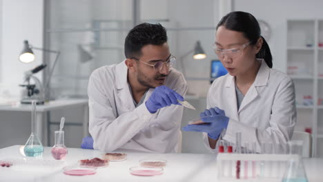 scientists discussing samples in a laboratory setting