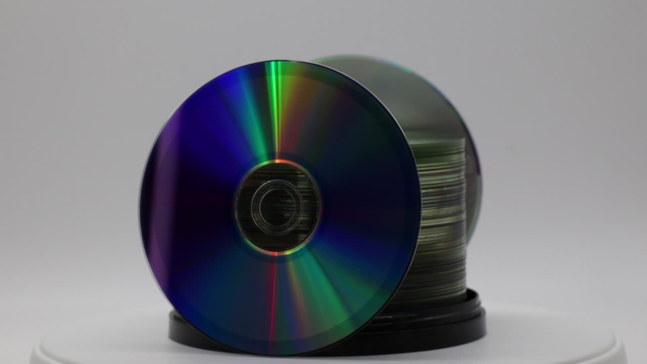 A stack of DVDs rotating on white background