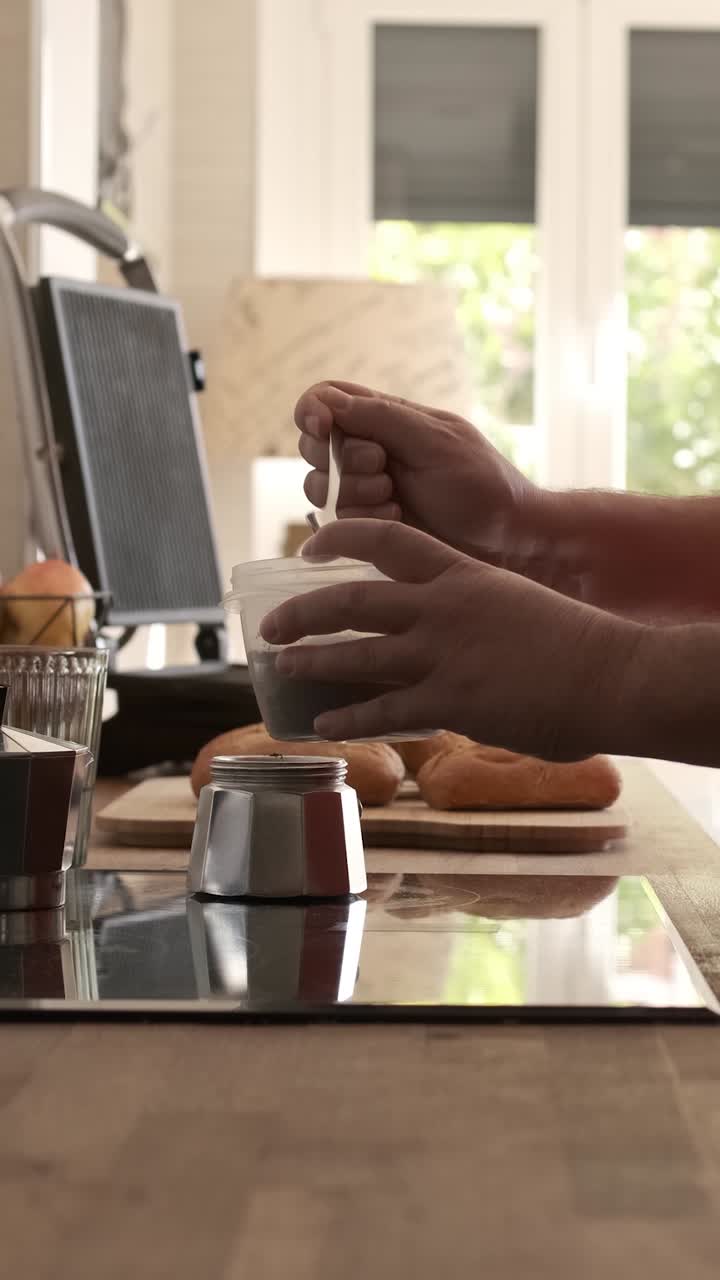 Gay couple preparing coffee and breakfast table at home