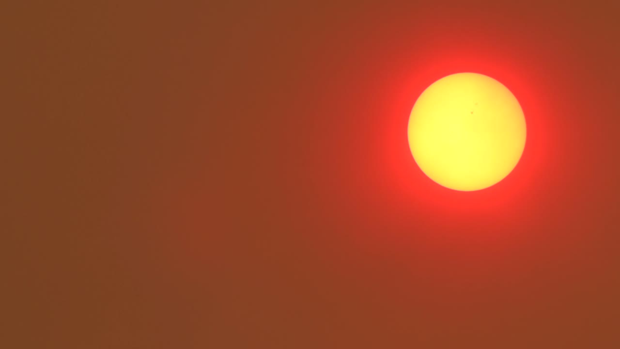Bright Glowing Red Orange Sun With Hazy Sky From Bush Fires And Smoke, Daytime Australia, East Gippsland, Victoria, Maffra