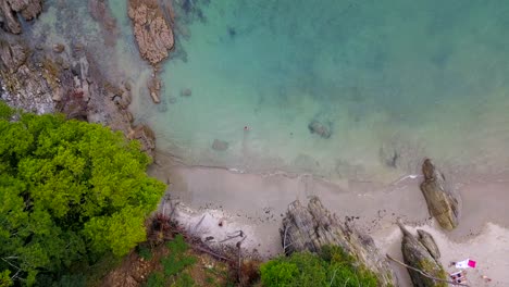 Aerial-drone-view-of-a-person-swimming-in