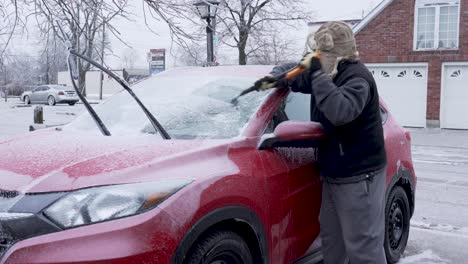 Scraping-ice-from-car