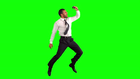 businessman taking self portrait while jumping