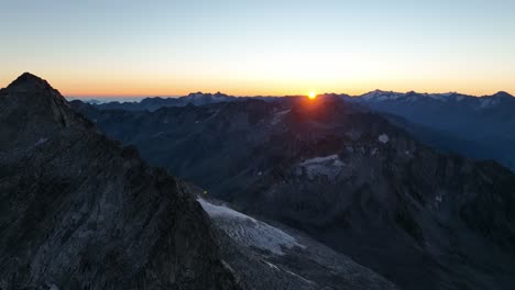 sunrise in the alps. drone footage of rocky mountains in italy.