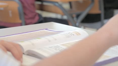 Book-on-a-student's-desk