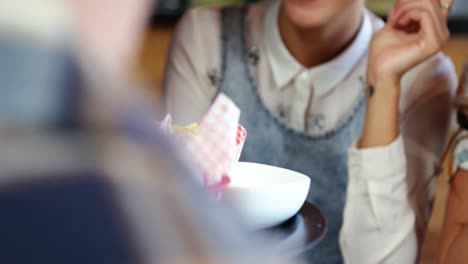 Waitress-serving-burger-to-customers