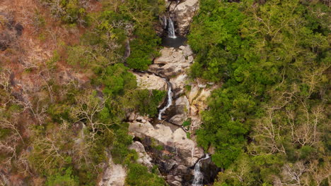 A-Majestic-5-Story-Waterfall-Snaking-Down-The-High-And-Arid-Jungle-Mountains-Of-Nui-Chua,-Vietnam