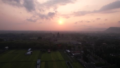 Aerial-view-of-sunset-and-silhouette-of-Prambanan-Temple,-a-Hindu-temple-in-Indonesia