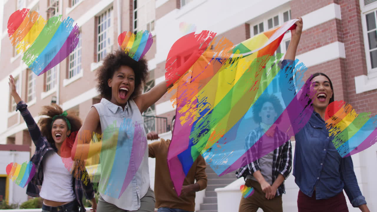 Video of rainbow flags over diverse people holding lgbtq flag at demonstration