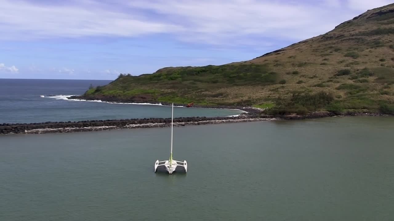 Aerial View of a Trimaran Sailboat Moored in a Calm Bay