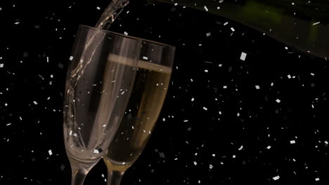 animation of white confetti falling over champagne pouring in a glass against grey background