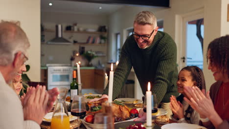 family celebrating thanksgiving dinner