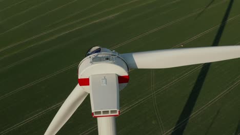 majestic machinery for gaining energy from nature. slide and pan aerial shot of wind power station under construction. green energy, ecology and carbon footprint reduction concept