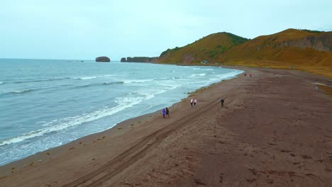 coastal hiking trail with people on a beach