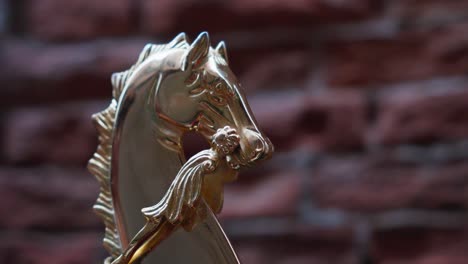golden horse ornament on a gondola in venice, italy - close up