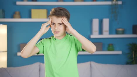 boy with headache.