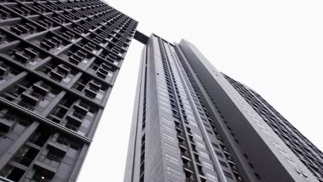 a low angle view in a public place looking up to see a very tall condominium