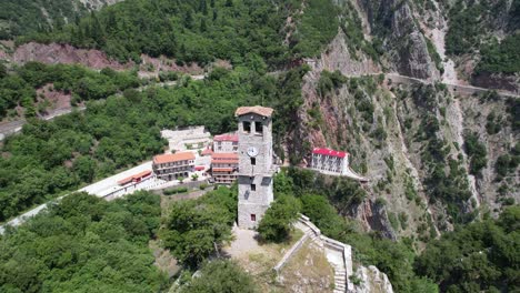 prusos monastery in evritania greece, aerial point of interest shot, scenic view with clock tower in foreground