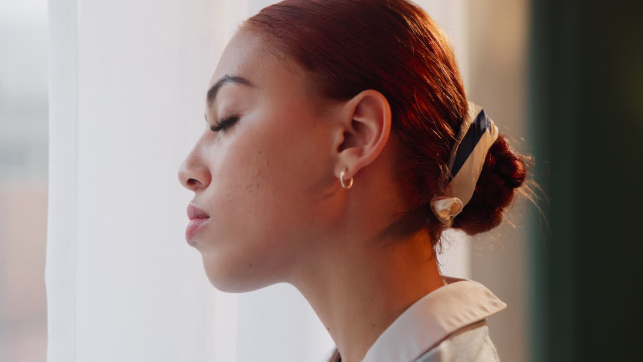 Woman with red hair in a bun